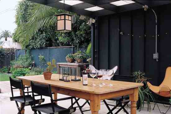 In the mild Los Angeles climate, outdoor living space is essential. Several times a week, Claudio and Jana eat dinner on the covered patio behind their office, and they often entertain there as well. The outdoor room adjoins the couples giardino segreto (secret garden), which is protected on all sides.